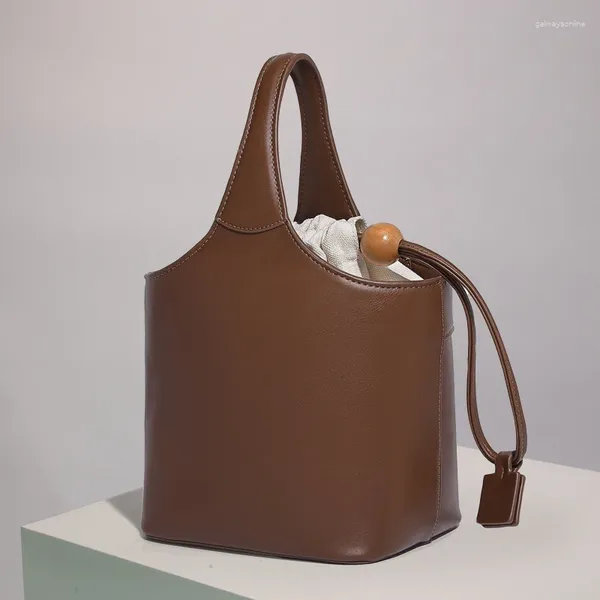 Bolsas de noche Mini cubo vintage para mujeres Bolsos y monederos de diseñador de lujo 2024 en PU Pilar de madera Cierre de cordón Hombro