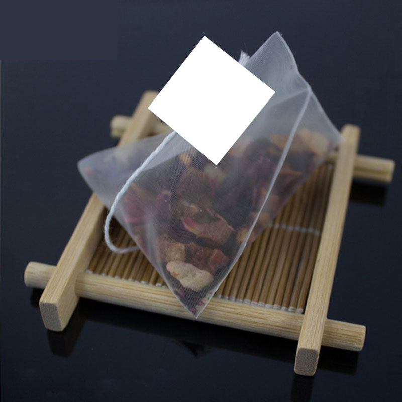 

100pcs/lot nylon pyramid tea bags filters transparent empty Tea Bag 5.5*7cm