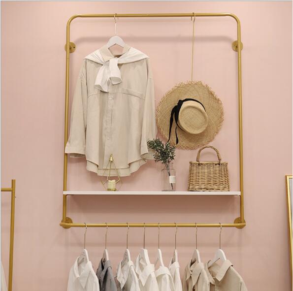 Clothing store wall hanger display rack Commercial Furniture Scandinavian women's cloth shop creative clothes and hats racks-image-489533190