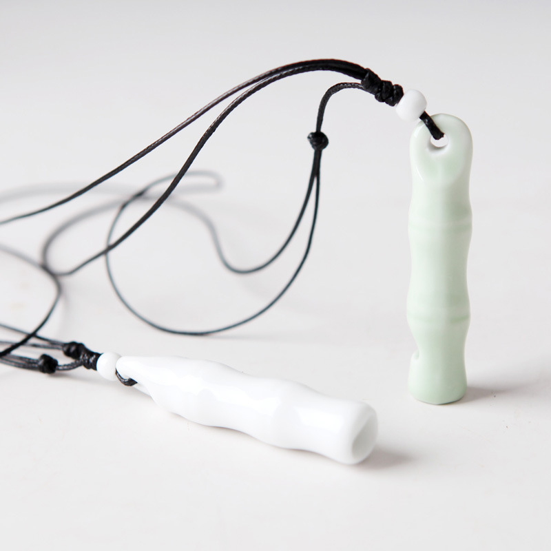 

Handmade ceramic whistle necklace, bone pendant, interesting ceramic jewelry sweater chain
