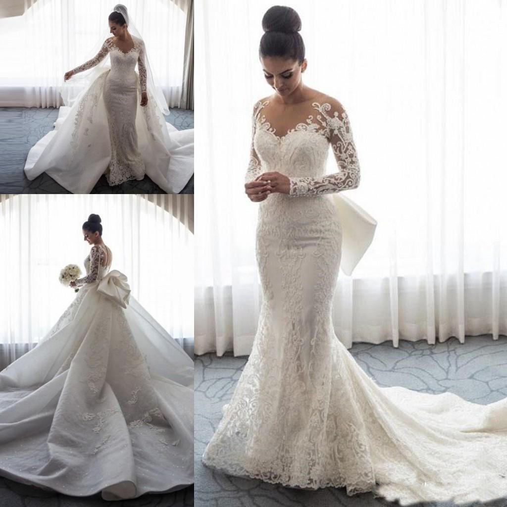 

2019 Luxury Mermaid Wedding Dresses Sheer Neck Long Sleeves Illusion Full Lace Applique Bow Overskirts Button Back Chapel Train Bridal Gowns, Same as image