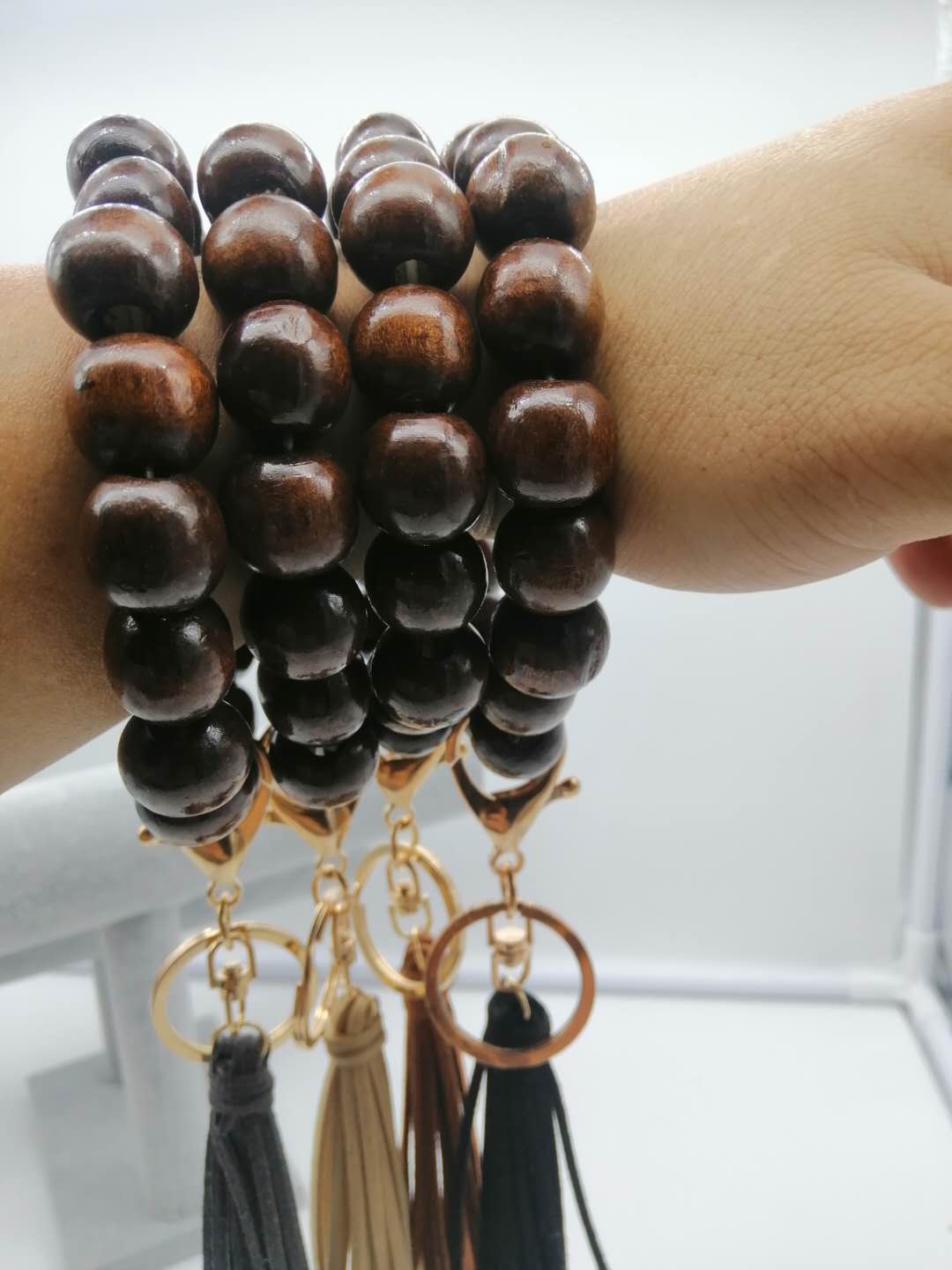 Commerce extérieur personnalisé bracelet en corde élastique en perles de bois tissées à la main version coréenne de porte-clés pendentif gland en