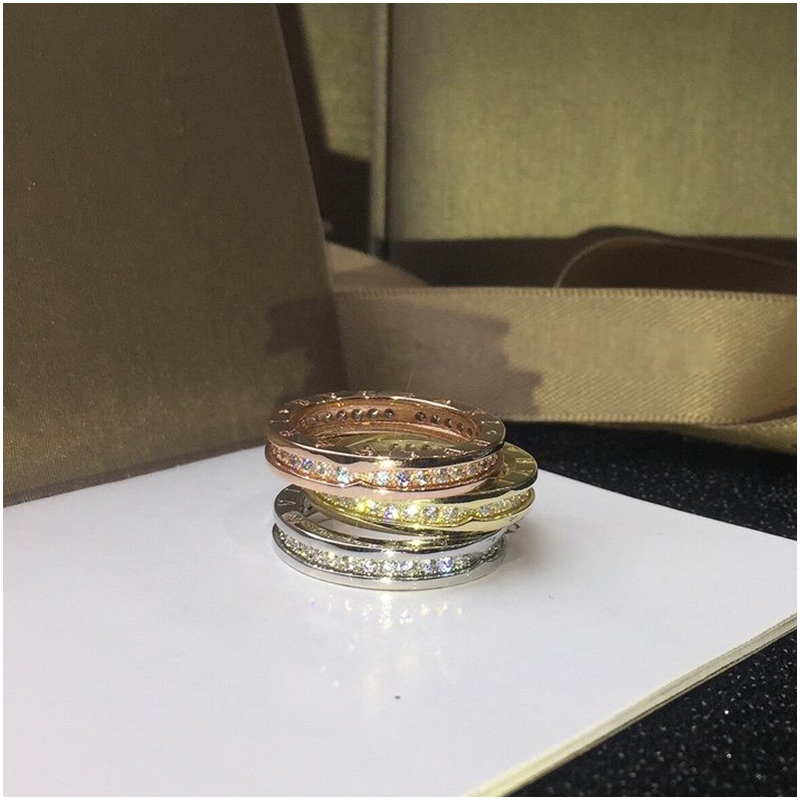 

Designer Jewelry Women Gold Rings Hip Hop Iced Out Rings Micro Paved Diamond Engagement Wedding Finger Rings for Women with Stamp
