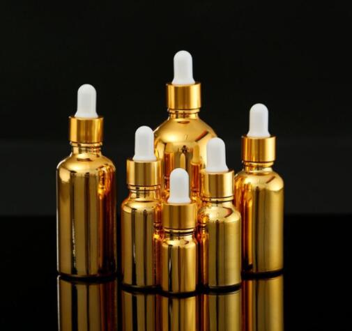 

New Gold-plated 50ml/100ml glass essential oil empty bottle split dispensing bottle glue-head dropper bottle