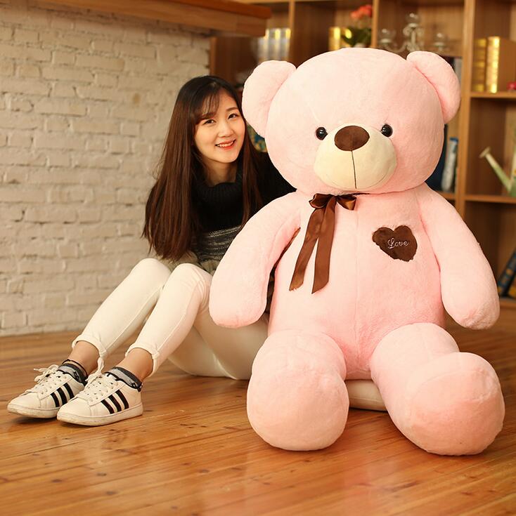 girl with giant teddy bear