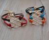 

Wholesale- gold colr one direction fashion jewelry infinity bracelet charm leather for women wholesale (can mix different goods )20pcs/lot