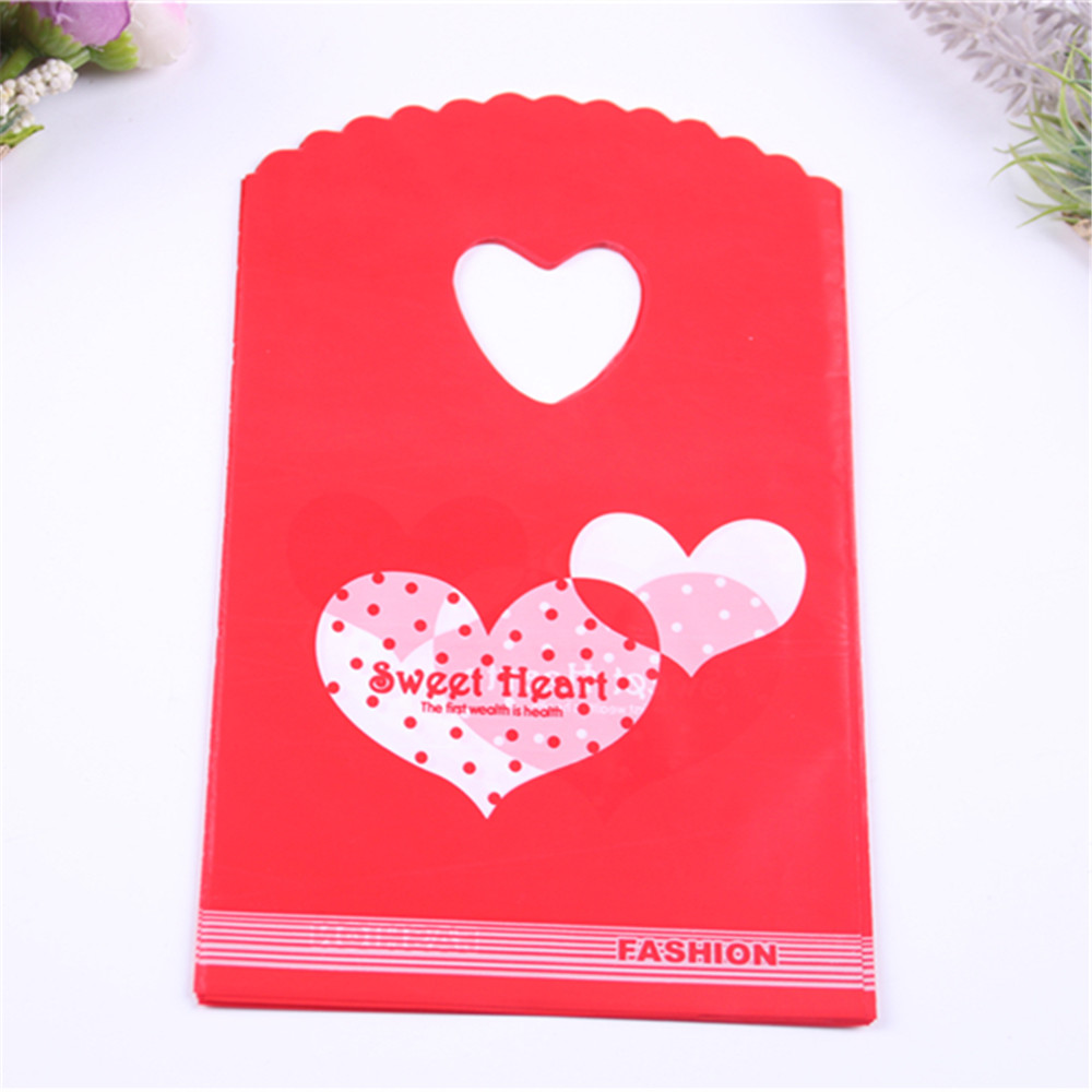 

Wholesale 50pcs/lot 13*20cm Red Gift Packaging Bags with Sweet Heart Plastic Sachet Cadeau Bags for Party Birthday