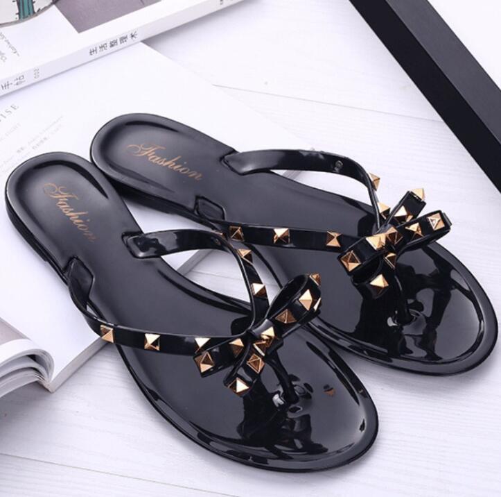 

Women's shoes 2019 Summer new sandals and slippers Flat with bow rivets slippers Flip-flops Garden jelly beach sandals