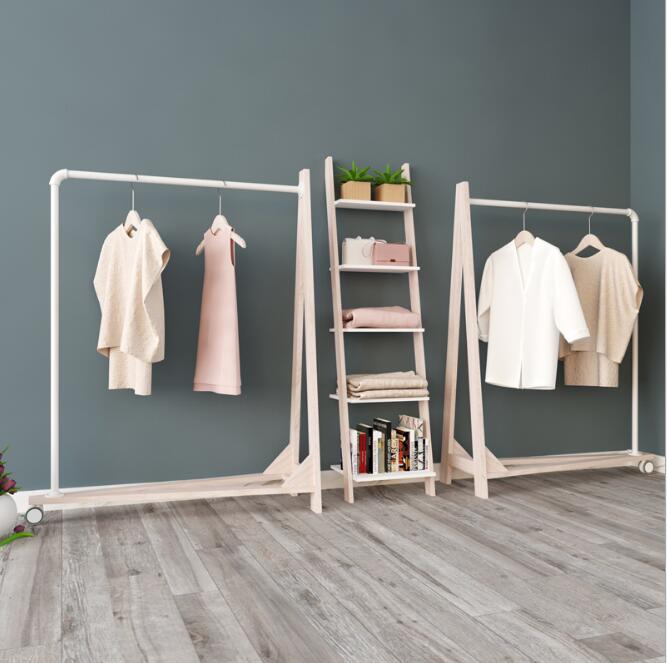 High end clothing store display hanger Bedroom Furniture solid wood iron tube A-shaped single side landing roller Home Hotel shopping mall show s-image-508236022