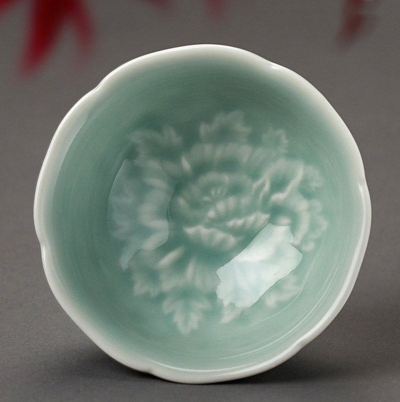 

Ceramic peony tea cup christmas Celadon relief single Master Cup celadon lotus cup