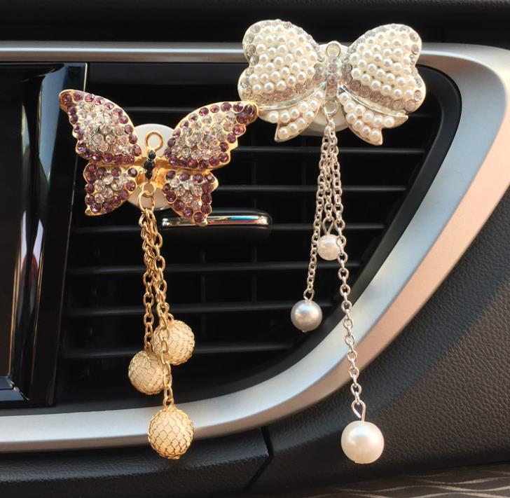 

Bow pendant out of the mouth perfume clip creative car accessories female car aromatherapy