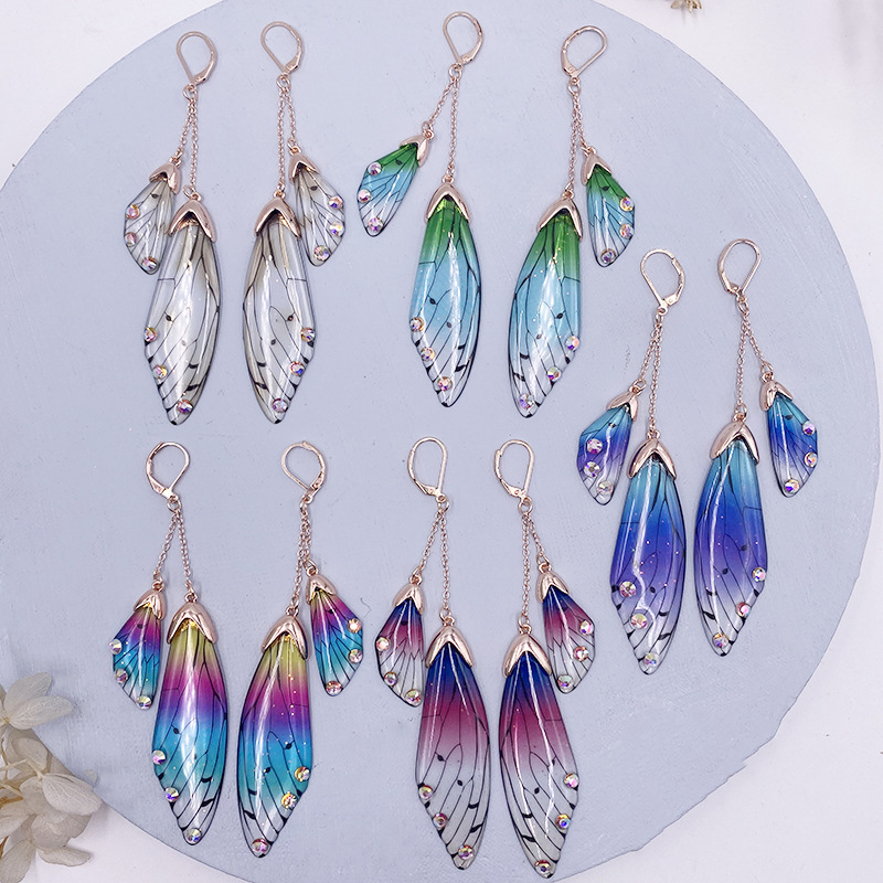 

Nina Temperament Long Butterfly Crystal Ear Stud Female Cool Flap Wings Gradient Color Fresh Earrings Manufacturers Hot Sale Moq1, Golden