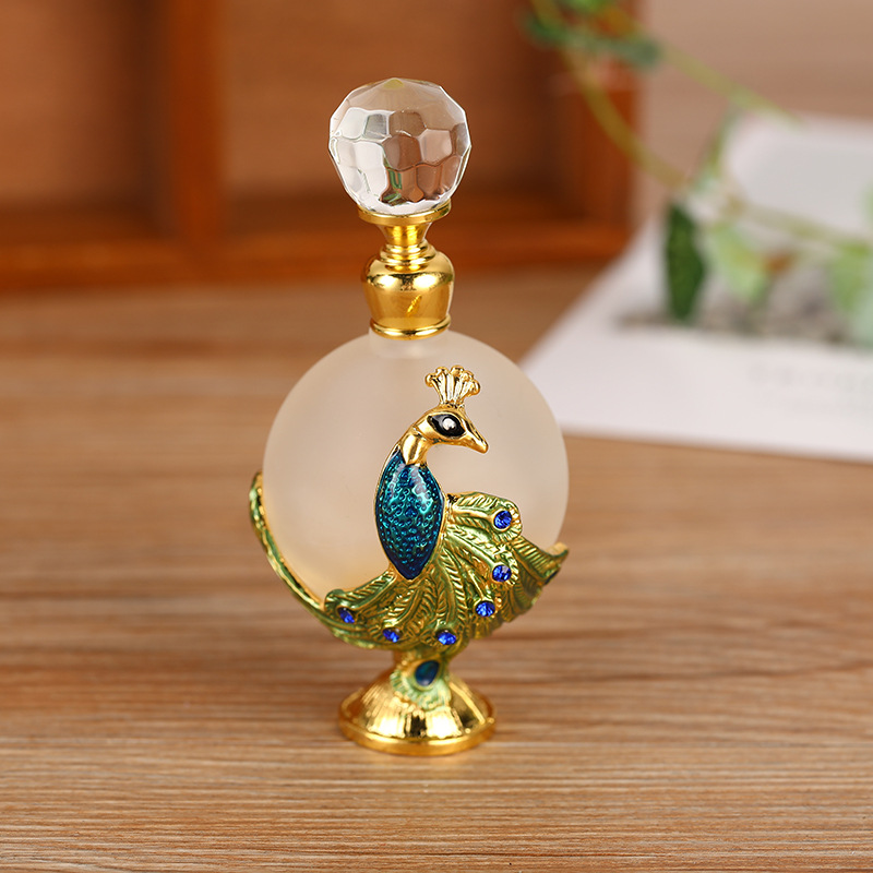 

50Pcs Factory Price 25ml Perfume Bottle Essential oil Essence Fragrances Vials Frosted Glass Arab Style Peacock Alloy Decoration