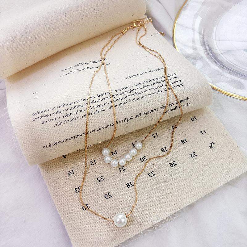 

Fairy temperament pearl double short necklace Korean fashion simple pearl clavicle chain female neck chain tide