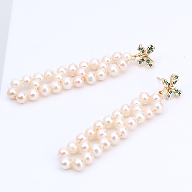 

The S925 silver needle allergy proofing exquisite handmade jewelry with true natural white freshwater pearl stud gold fillings