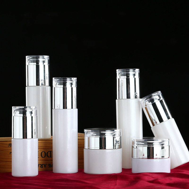 

50pcs New pearl white cosmetic glass Essence lotion bottle set skin care cream jar silver lid 20ml 30ml 40ml 50ml 60ml 80ml