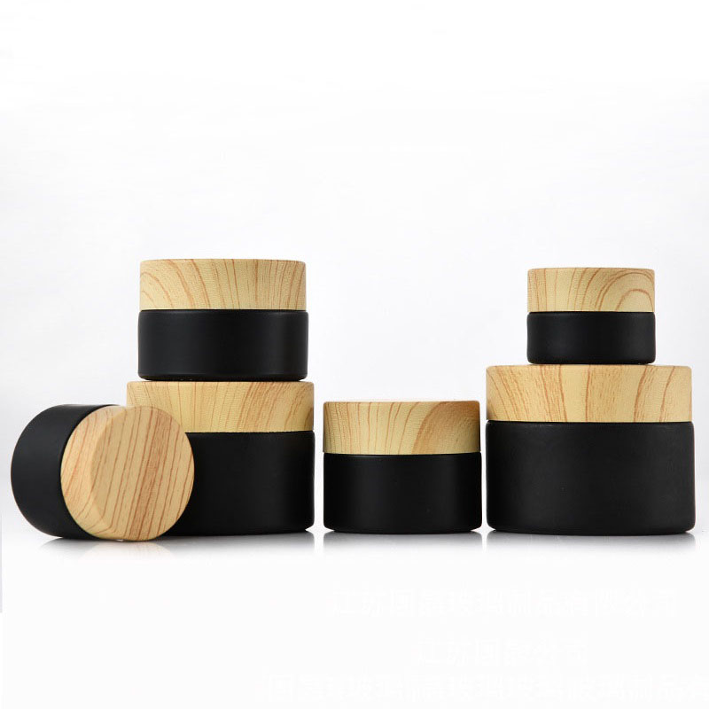 

Black frosted glass jars cosmetic jars with woodgrain plastic lids PP liner 5g 10g 15g 20g 30 50g lip balm cream containers DWF2387
