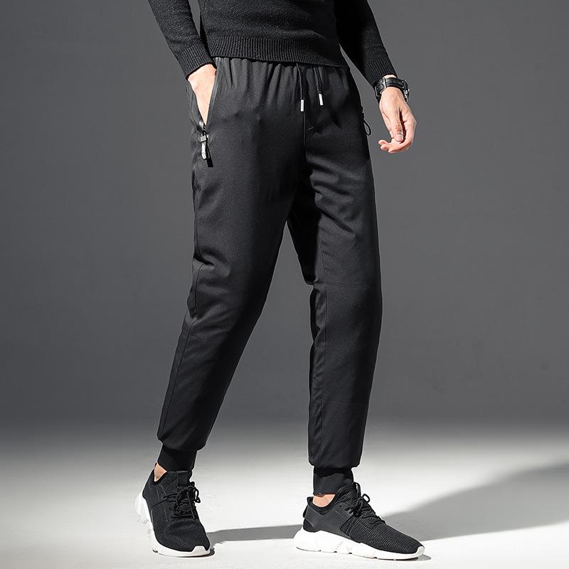 

outside a man wear black white duck down small foot type waist thickening in the pure color leisure warm down pants