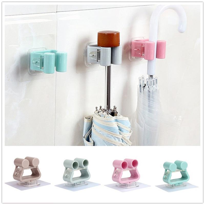 

PP Self Adhesive No Drilling Wall Mount Mop and Broom Holder Bracket Hanging Organizer for Home Bathroom Use 7 x 7cm1