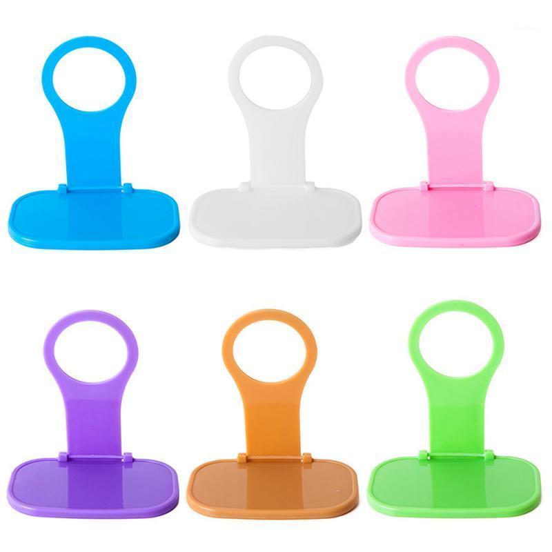 

Portable Mobile Phone Charger Wall Hanger foldable phone charging stand Adapter Hanger Cable Tidy Random Color Fast delivery1