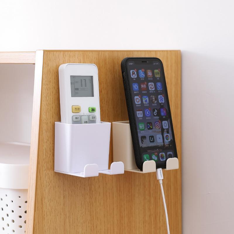 

Wall-mounted storage box home wall wire storage rack remote control mobile phone charging bracket creative plastic box1