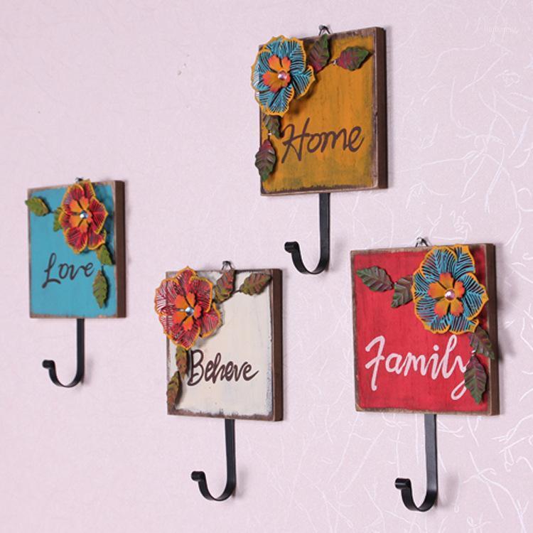

Rustic iron flower wall fitting room vintage retro wall finishing coat hooks door after1