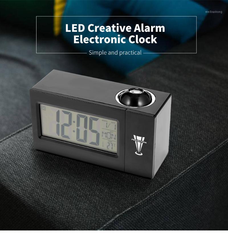 

LCD Screen Digital LED Projection Alarm Clock Calendar Temperature Humidity Wake Up Snooze Function Table Desk Clock Night Light1