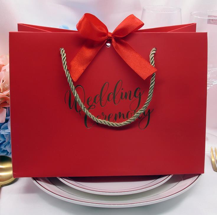 

High-quality gifts Bow gift bag Portable paper bag Wedding supplies Tote wrapping paper bags with handle SN30351