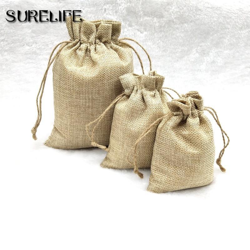 

50pcs/lot Vintage Natural Burlap Jute Gift Bags Candy Bags Wedding Favor Pouch Drawstring Jewelry Packaging Bag1
