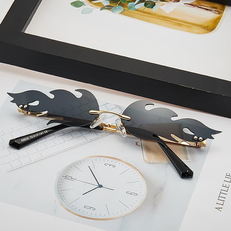 

Fashion flame Sunglasses Women's rimless small frame color Sunglasses wave Retro Metal UV4001