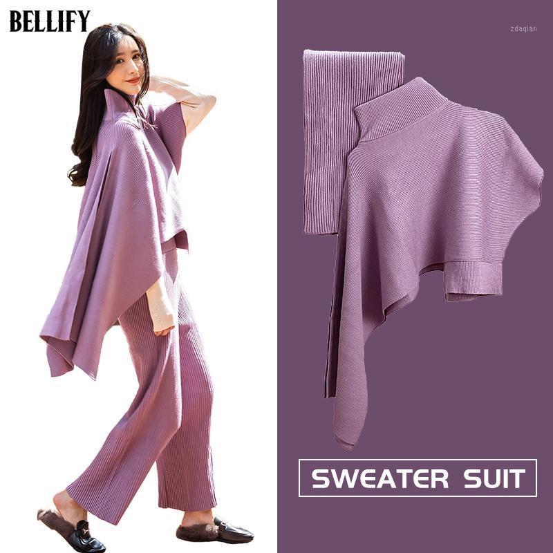 

Women Knitted 2 Pieces Outfits Irregular Crop Top Long Pants Sweater Suits Warm Turtleneck Cape Sets1, Khaki