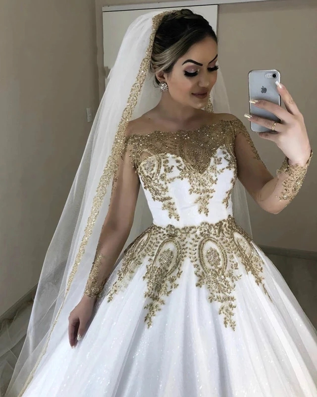 

2021 Luxury Dubai White And Gold Wedding Dresses Sheer Long Sleeves Bateau Neck Appliqued Sparkly Glitter Sequins Lace Bridal Formal Gown, Champagne