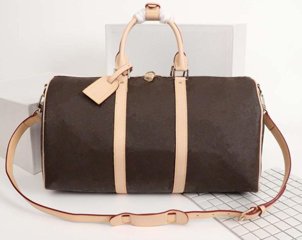 

Top Quality 55cm capacity women traveling bag men shoulder bag duffel bags carry on luggage bottom rivets with lock head backpack, Brown grid with logo