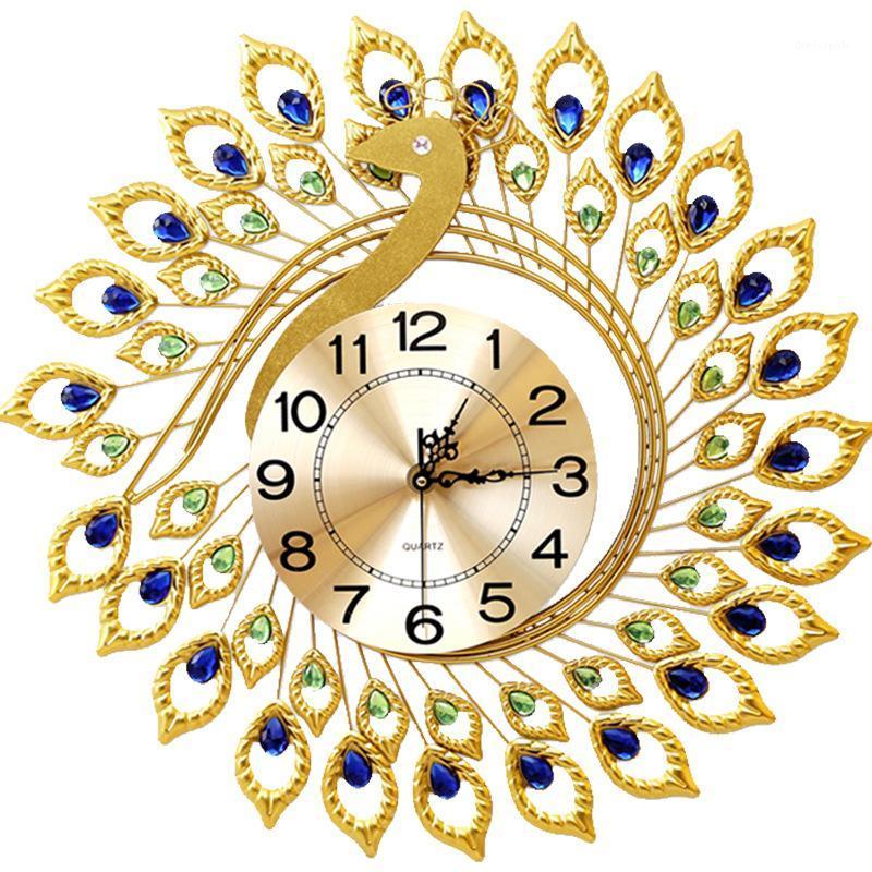 

European modern creative living room iron wall clock Golden Peacock Phoenix metal wall clock modern design1