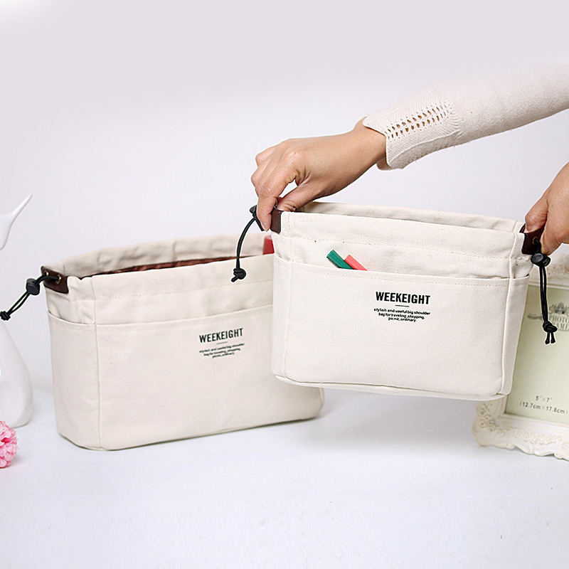 

A portable canvas liner cosmetic bag for storage and finishing with a liner, White