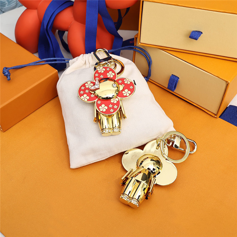 

Fashion Keychain Luxury Designer Stylish Sun-flower Doll Pendant Keychains Three Colors Keys Buckle Mens Womens Keys Ornaments High Quality