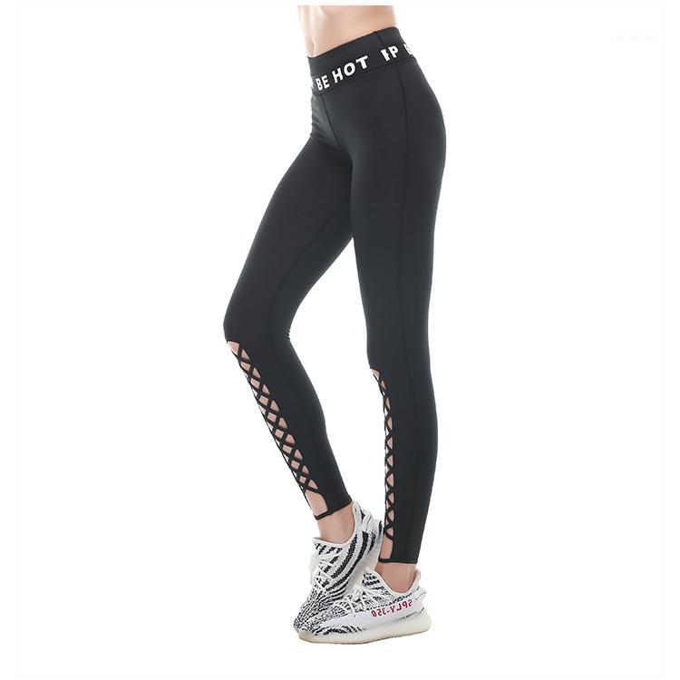 

Eshtanga Yoga crop high waist Women Sports leggings Solid Elastic Waist Yoga pants Cross Design hollow out capris Free Shipping1, Black