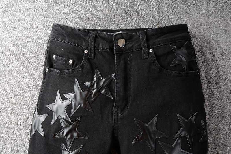 

High street fashion brand Amirs black five pointed star jeans for young men