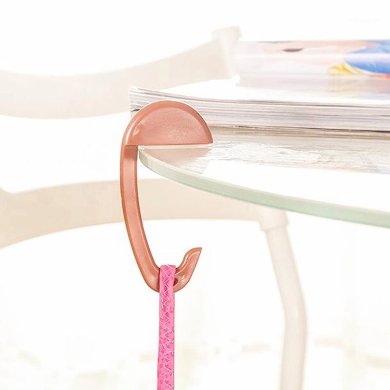 

1Pc Portable Plastic Bag Hook Clothes Purse Bag Hanger Buckle Device Table Chair Desk Brim Hook Handbag Holder Travel Tools1