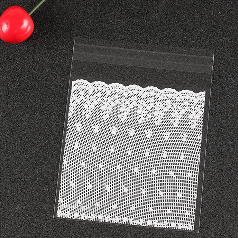 

100pcs plastic transparent white lace candy biscuit gift bag and DIY self-adhesive bag wedding birthday party packaging1
