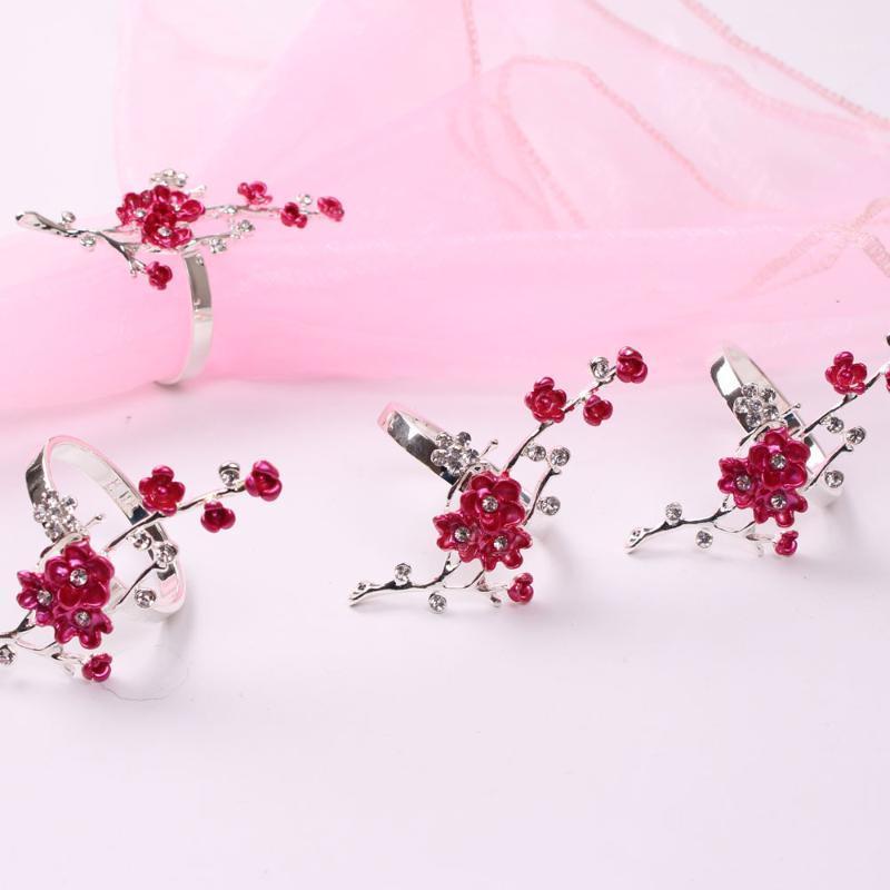 

TAI Top 12Pcs Plum Blossom Crystal Napkin Rings Metal Silver Color Hotel Towel Buckle Napkin Holder Party Wedding Table Decor1