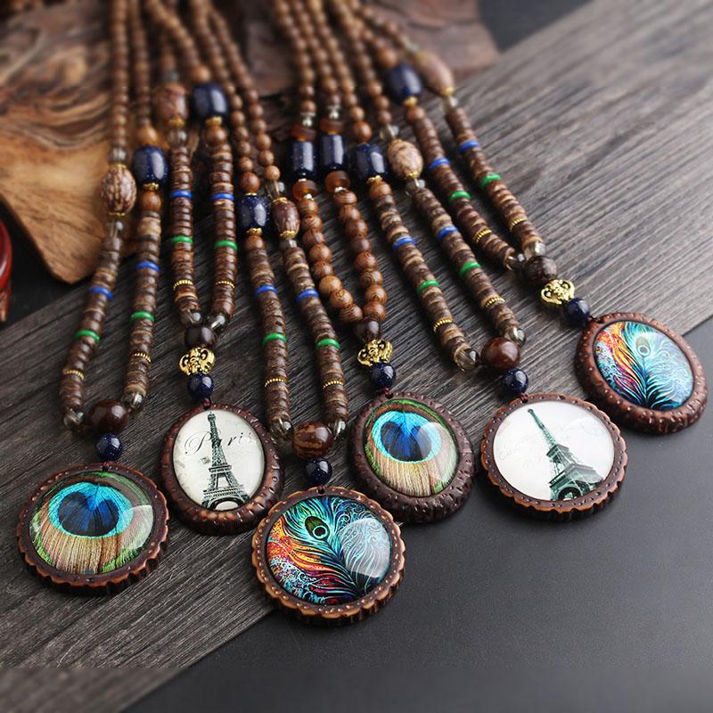 

WEIYU Fashion Ethnic Peacock Feather Necklace Nepal Handmade Wood Beads Long Sweater Necklace Vintage Tower Pendant