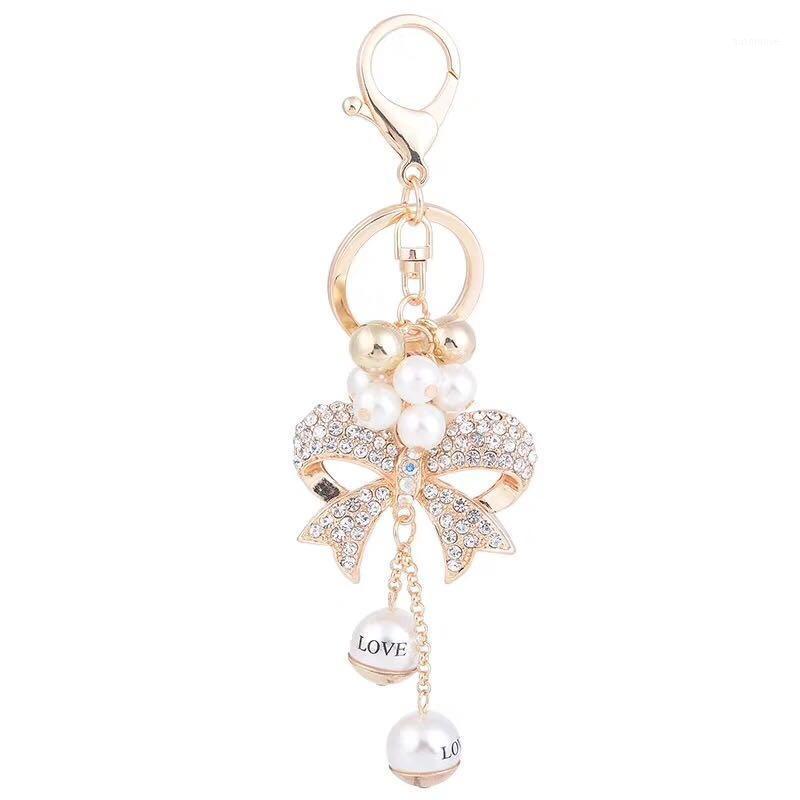 

New fashion creative crystal bow keychain love pearl car key ring female bag pendant accessories charm jewelry gift key chain1