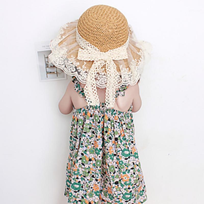 

Girls Hats Summer Flowers Bow Straw Hat New Children's Beach Cap Wide Brim Bohemia Cap Sun Hats1