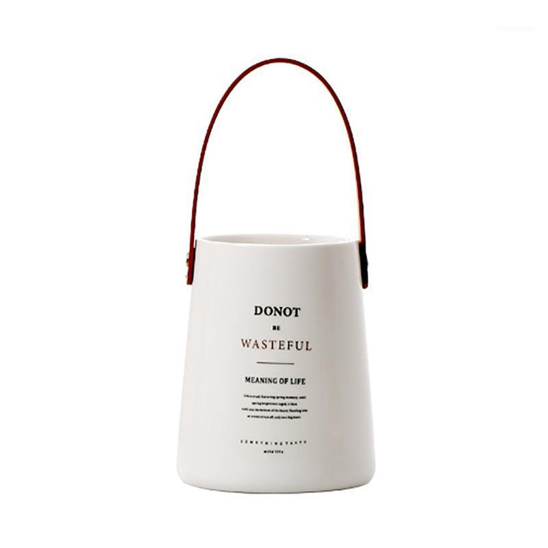

Unique Chic Nordic Ceramics Storage Jar Bottle With Leather Handle Minimalist Desk Storage Bottle Organizer Flower Vase Containe1