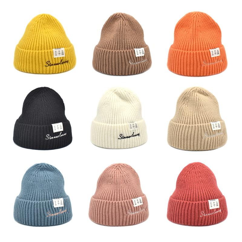 

Women's winter warm hat pure color embroidered wool hat Japanese and Korean label knitted couple fashion warm cap
