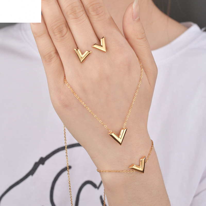 

Letter V Charm Bracelet Necklace Earrings Sets for Women Stainless Steel Silver Gold Chain Bracelet V Triangle Cute Stud Earrings