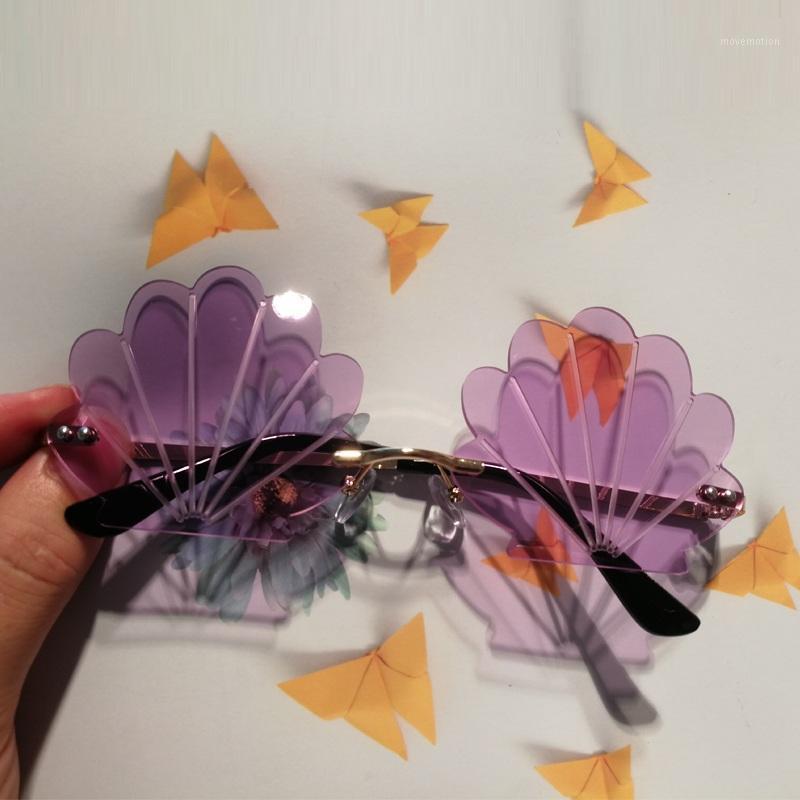 

QPeClou 2020 New Fashion Rimless Shell Sunglasses Women Metal Frameless Funny Party Sun Glasses Female Colorful Shades Oculos1