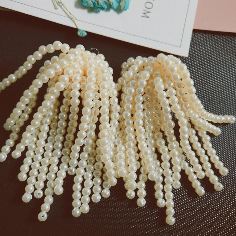 

European and American exaggerated custom hand made handmade pearl tassel ear clip no ear hole limited edition earrings female