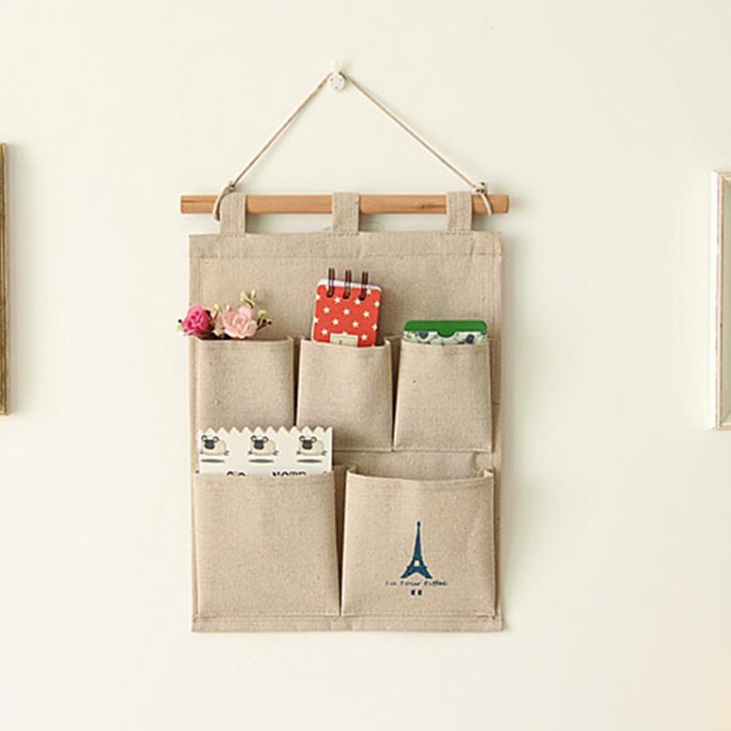 

Wall decoration cotton and linen moisture-proof storage hanging bag remote control home debris storage hanging bag wall1, Blue tower